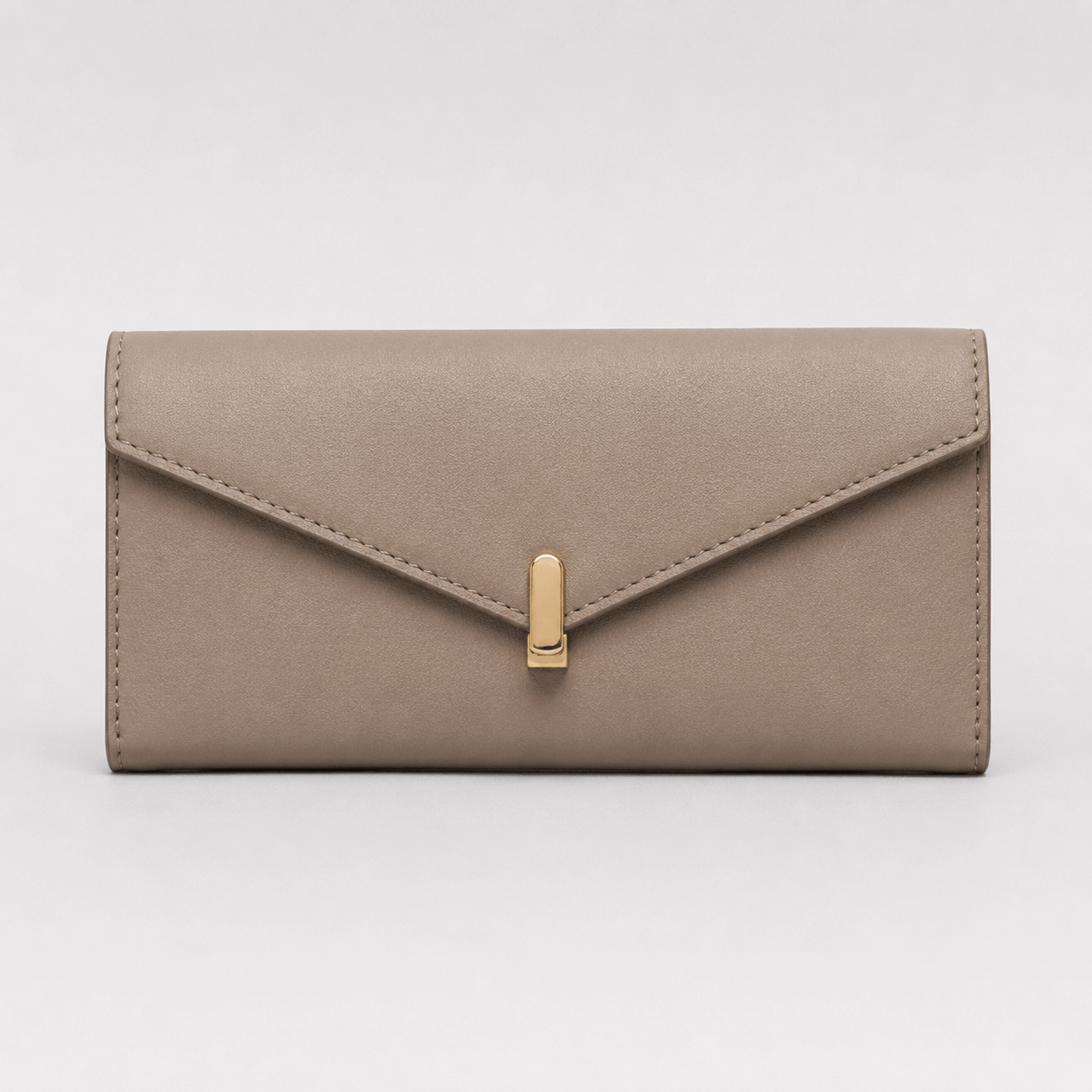 Beige wallet with a gold clasp on a light gray background