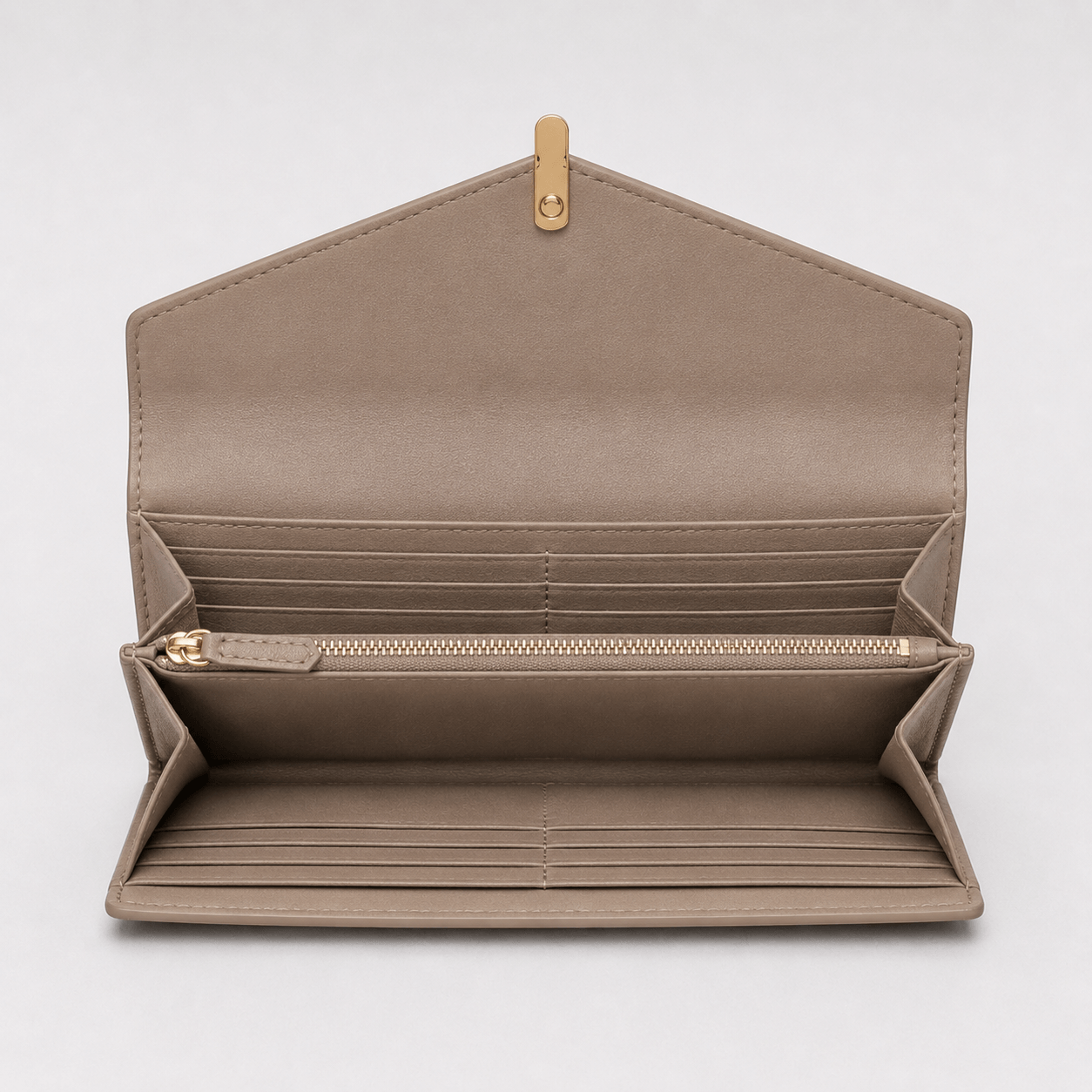 Open beige wallet with gold zipper on a light gray background